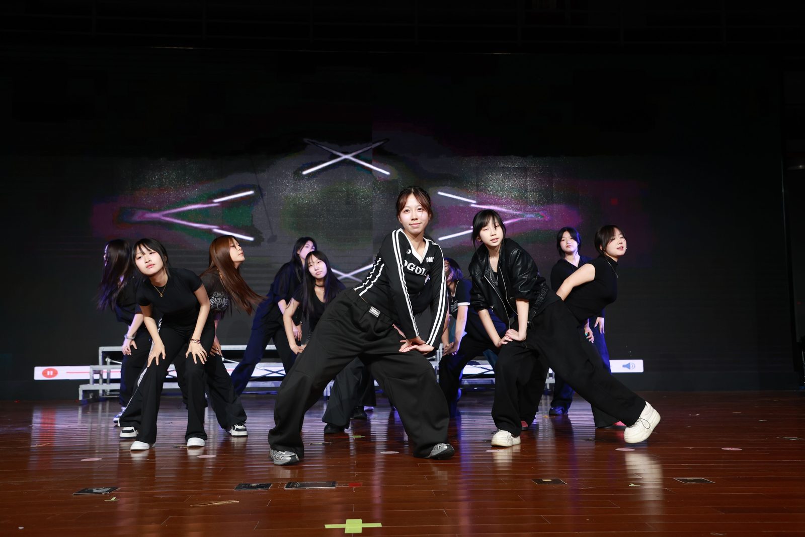 The dance club performs on stage