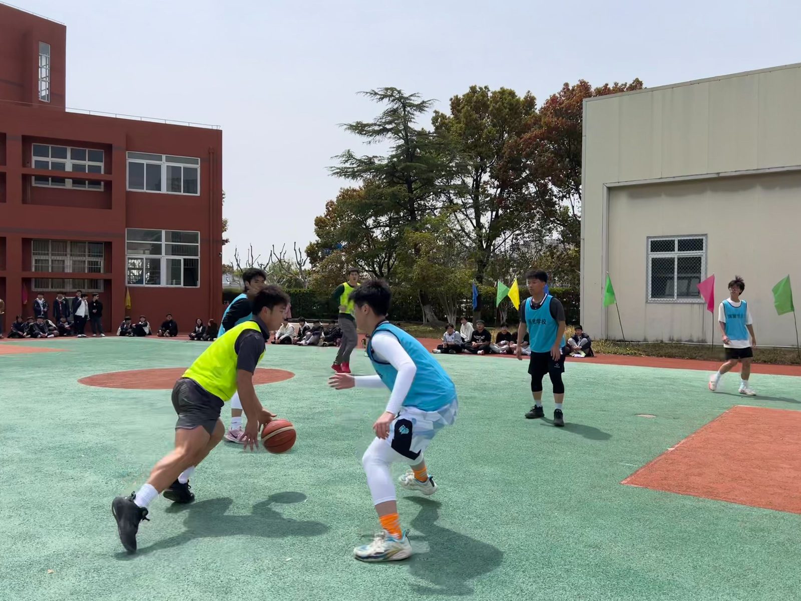 Boya school basketball team in a match on the outdoor court